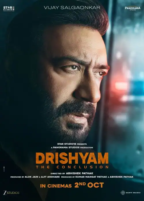 Indian Hausa Films Close-up of Vijay Salgaonkar in Drishyam poster, looking serious, with movie title and release date. | Arewa Movies TV